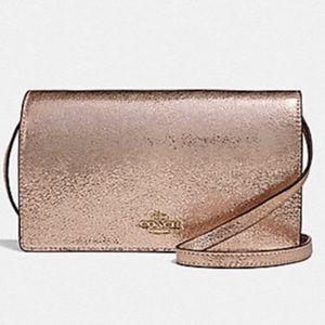 NWT rose gold coach clutch
